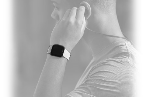 a man wearing a Universal Wearable health tracker